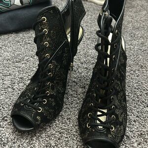 Cosmo black and gold heels